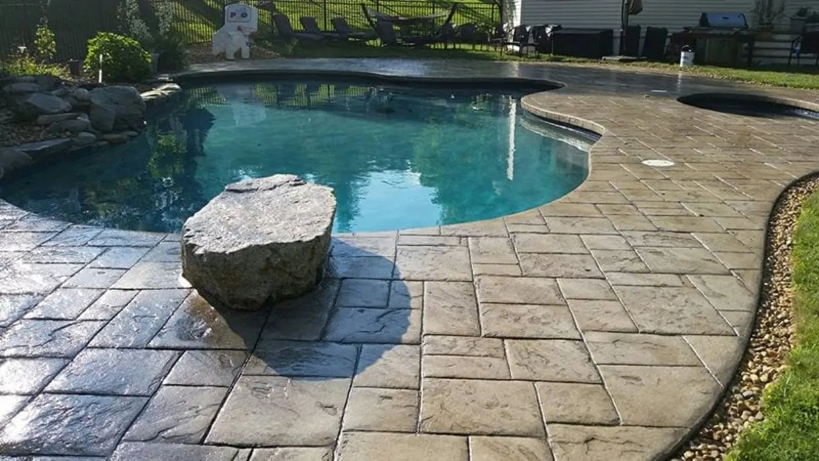 Stamped concrete pool deck in a Florida backyard